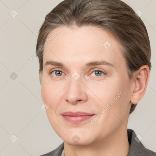 Joyful white adult female with short  brown hair and grey eyes