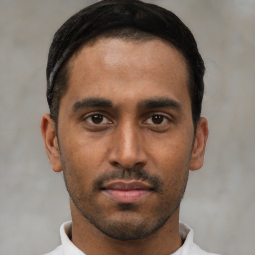 Neutral black young-adult male with short  black hair and brown eyes