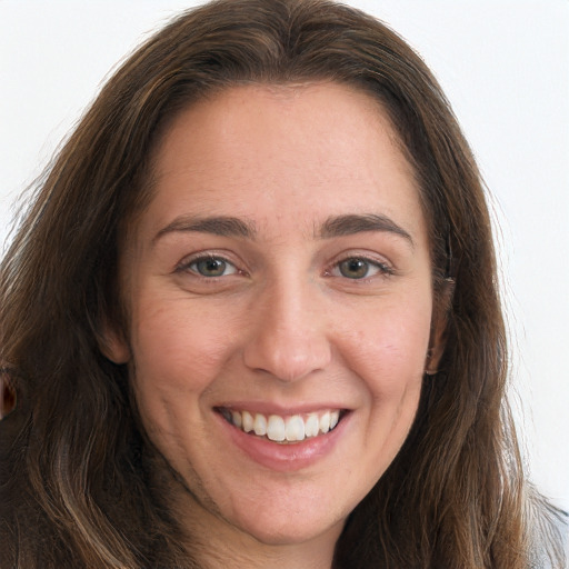 Joyful white young-adult female with long  brown hair and grey eyes