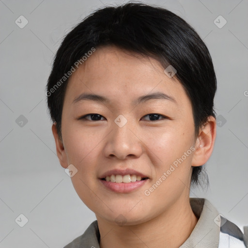 Joyful asian young-adult female with short  brown hair and brown eyes