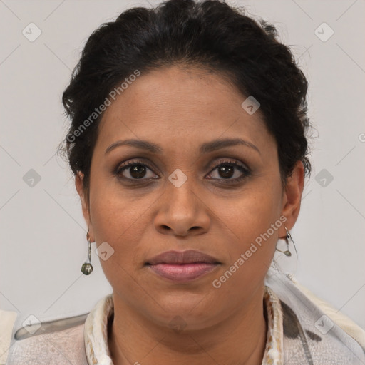 Joyful latino adult female with short  brown hair and brown eyes