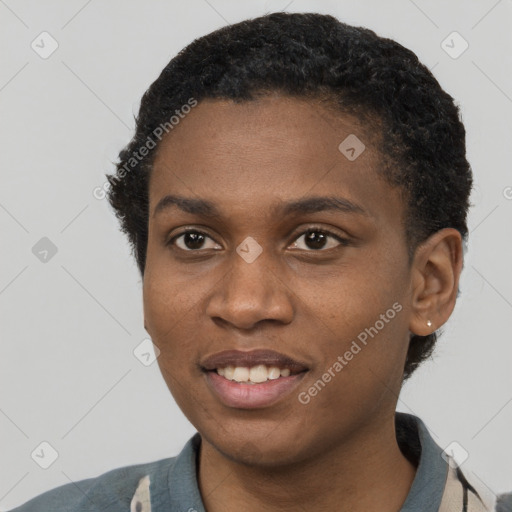 Joyful black young-adult female with short  black hair and brown eyes