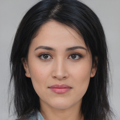 Joyful asian young-adult female with long  black hair and brown eyes