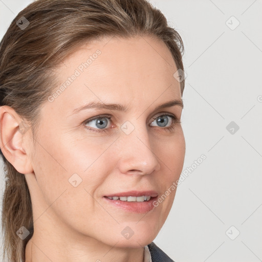 Joyful white young-adult female with medium  brown hair and blue eyes