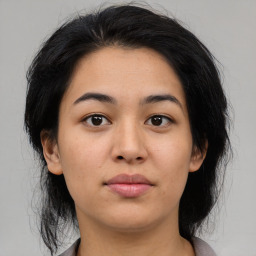 Joyful asian young-adult female with medium  black hair and brown eyes