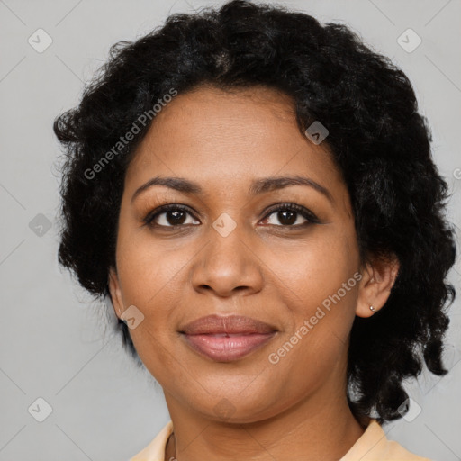 Joyful black young-adult female with medium  brown hair and brown eyes