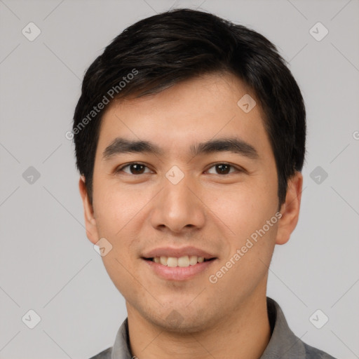 Joyful white young-adult male with short  black hair and brown eyes