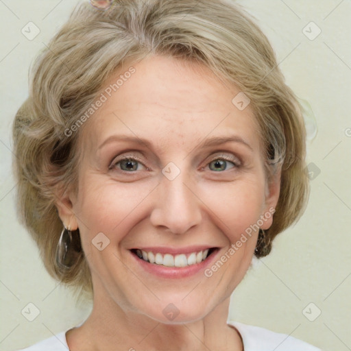 Joyful white adult female with medium  brown hair and blue eyes