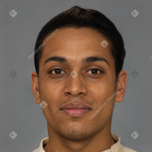 Joyful black young-adult male with short  brown hair and brown eyes