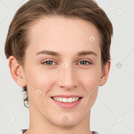 Joyful white young-adult female with short  brown hair and grey eyes