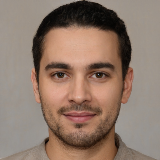 Joyful white young-adult male with short  brown hair and brown eyes