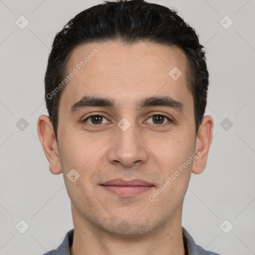 Joyful white young-adult male with short  black hair and brown eyes