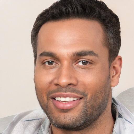 Joyful white young-adult male with short  brown hair and brown eyes