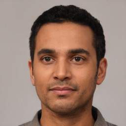 Neutral latino young-adult male with short  black hair and brown eyes