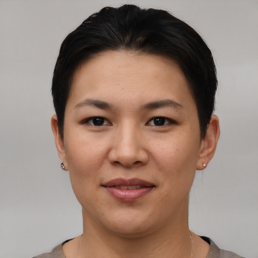 Joyful white young-adult female with short  black hair and brown eyes
