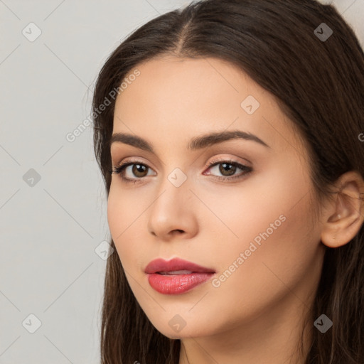 Neutral white young-adult female with long  brown hair and brown eyes