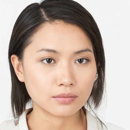 Neutral asian young-adult female with medium  brown hair and brown eyes