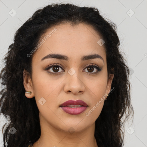 Joyful latino young-adult female with long  brown hair and brown eyes