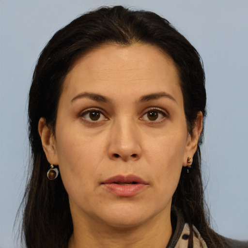 Joyful white adult female with long  brown hair and brown eyes