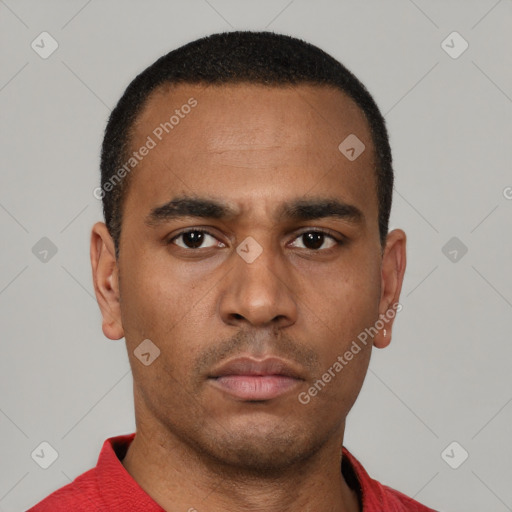 Neutral latino young-adult male with short  black hair and brown eyes