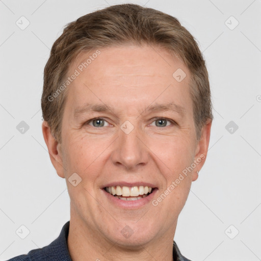 Joyful white adult male with short  brown hair and grey eyes