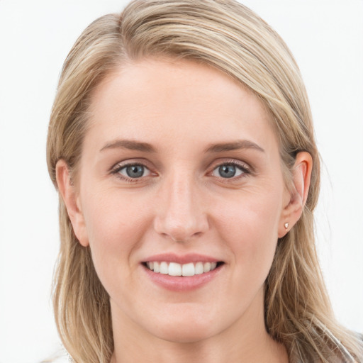 Joyful white young-adult female with long  brown hair and blue eyes