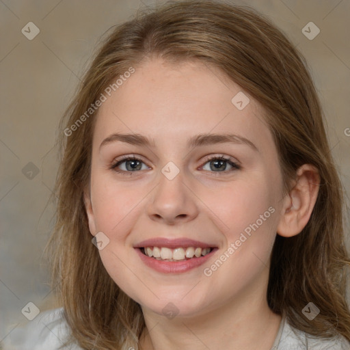 Joyful white young-adult female with medium  brown hair and blue eyes