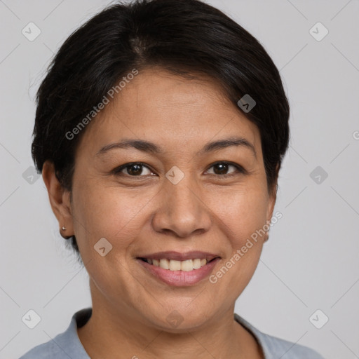 Joyful white adult female with short  brown hair and brown eyes