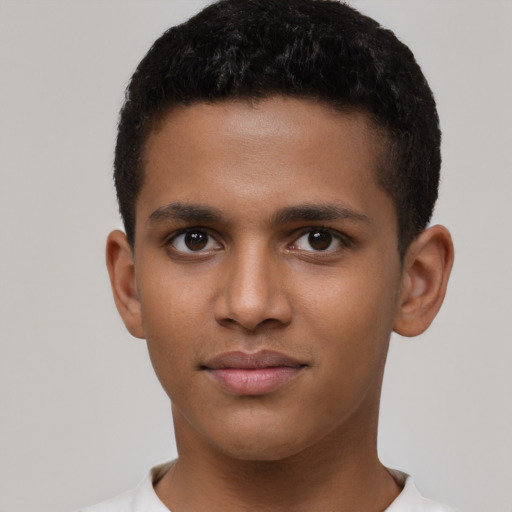 Joyful latino young-adult male with short  brown hair and brown eyes