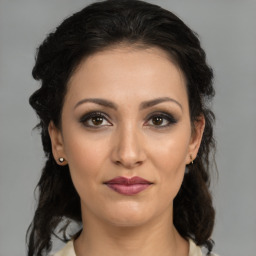 Joyful white young-adult female with medium  brown hair and brown eyes