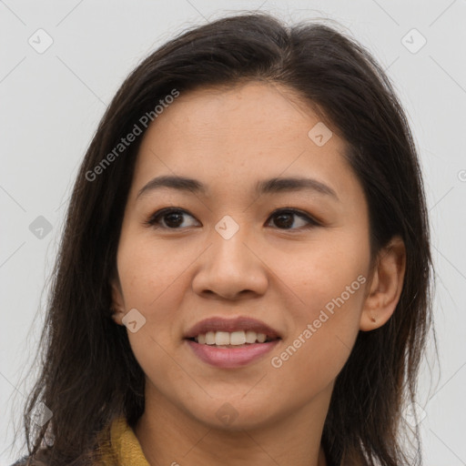 Joyful latino young-adult female with long  brown hair and brown eyes