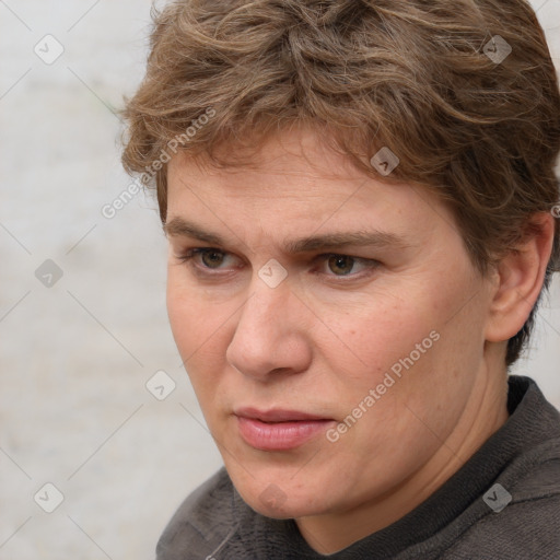 Joyful white adult female with short  brown hair and grey eyes