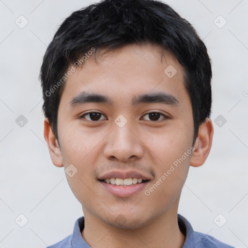 Joyful asian young-adult male with short  black hair and brown eyes