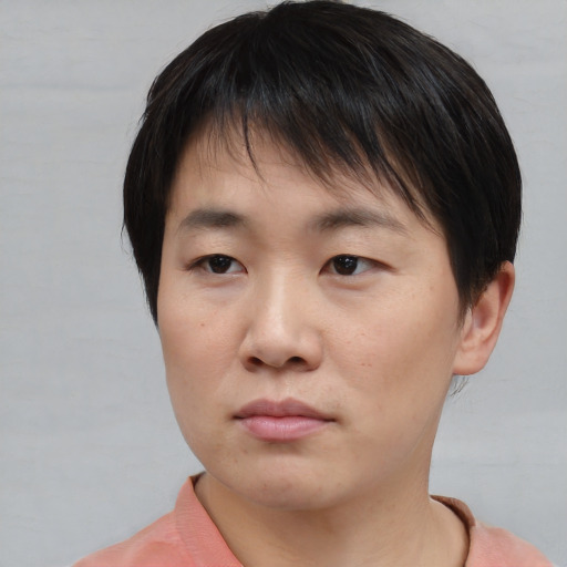 Neutral asian young-adult female with short  brown hair and brown eyes