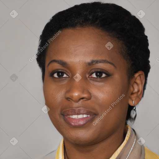 Joyful black young-adult female with short  brown hair and brown eyes