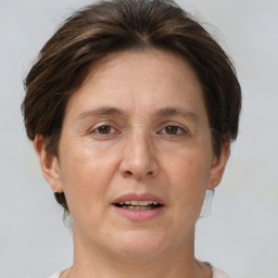 Joyful white adult female with short  brown hair and brown eyes