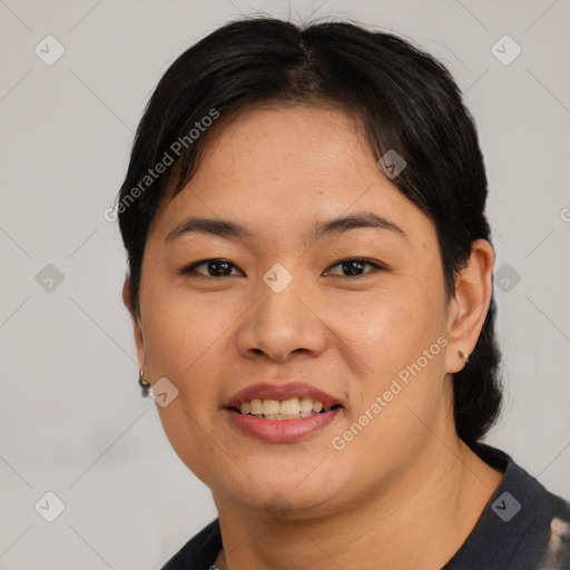 Joyful asian young-adult female with short  brown hair and brown eyes