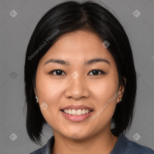 Joyful asian young-adult female with medium  black hair and brown eyes