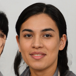 Joyful asian young-adult female with medium  black hair and brown eyes