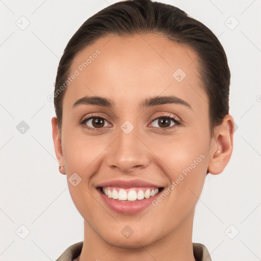 Joyful white young-adult female with short  brown hair and brown eyes