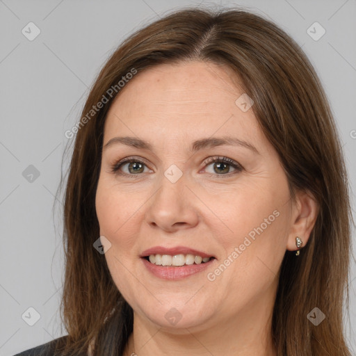 Joyful white adult female with long  brown hair and brown eyes