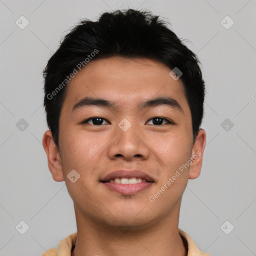 Joyful asian young-adult male with short  black hair and brown eyes