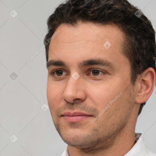 Joyful white young-adult male with short  brown hair and brown eyes