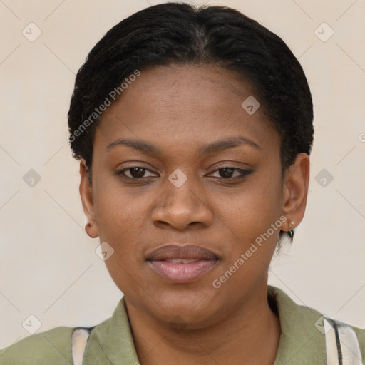 Joyful black young-adult female with short  brown hair and brown eyes