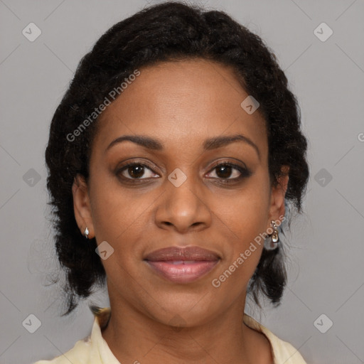 Joyful black adult female with medium  brown hair and brown eyes