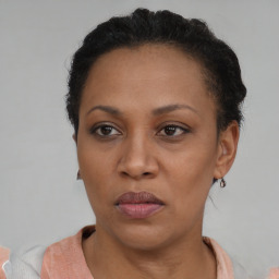 Neutral black adult female with short  brown hair and brown eyes