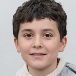 Joyful white child male with short  brown hair and brown eyes