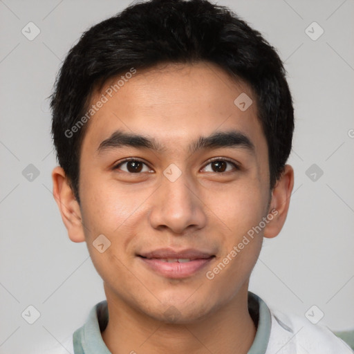 Joyful latino young-adult male with short  black hair and brown eyes