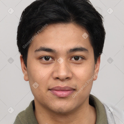 Joyful asian young-adult male with short  brown hair and brown eyes