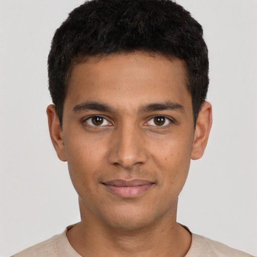 Joyful latino young-adult male with short  brown hair and brown eyes